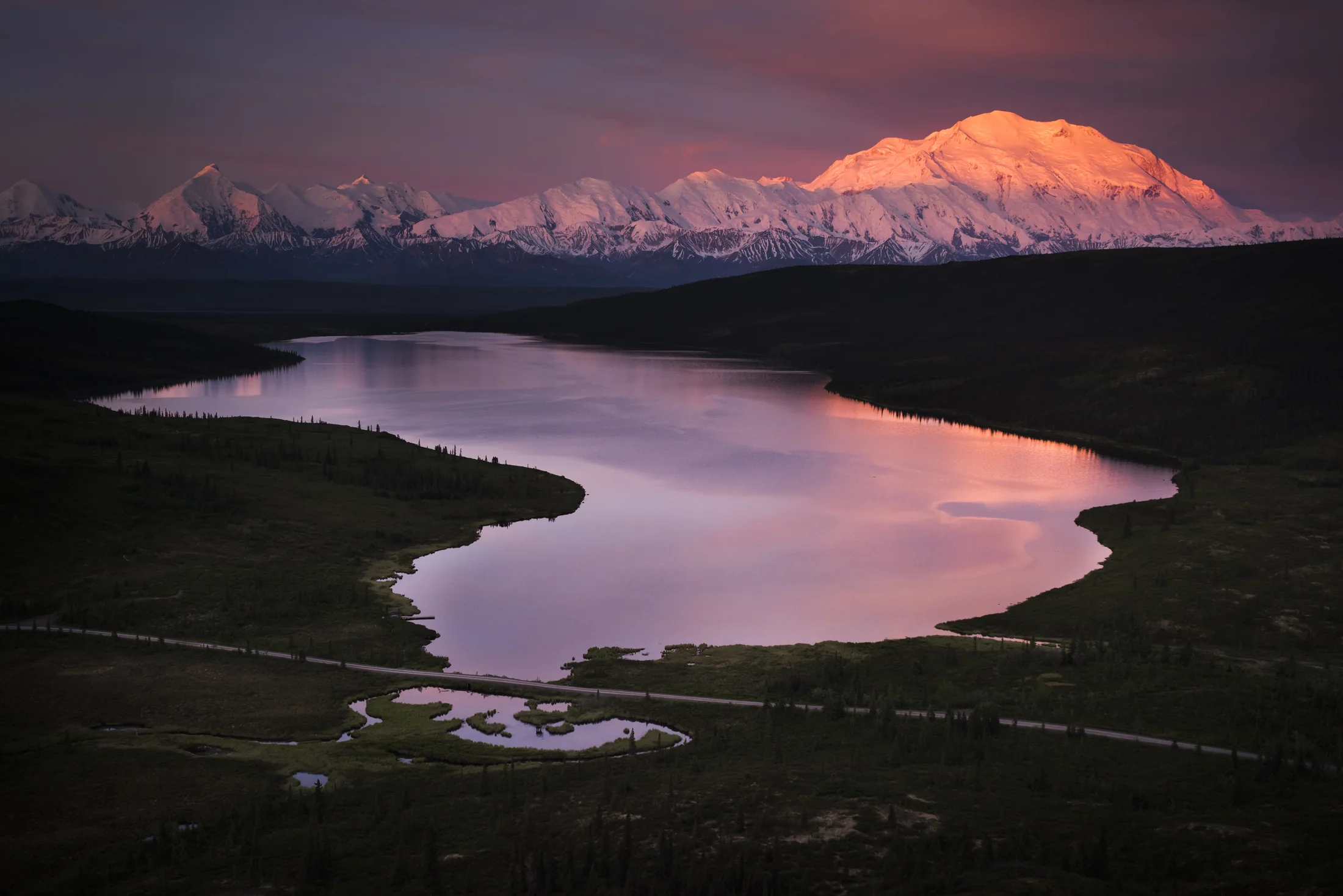 Denali at sunrise reflected in a lake